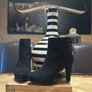 Black ankle zip up boots with lace tie back